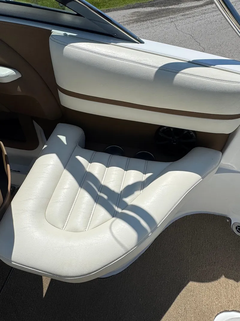 Slide: The Image of 2015 Cobalt R3 boat interior with white leather seating and brown accents. - 8