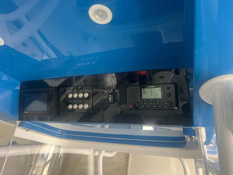 Slide: The Image of Control panel of 2022 Jupiter 34 FS boat with navigation and communication equipment. - 4