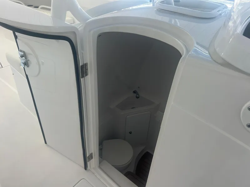 Slide: The Image of 2022 Jupiter 34 FS boat interior with compact bathroom and sink. - 8