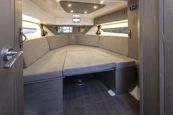 Slide: The Image of 2023 Beneteau GT32 interior cabin with cozy seating and modern design. - 19