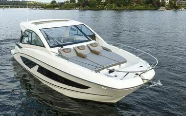 Slide: The Image of 2023 Beneteau GT32 boat cruising on a serene lake. - 3