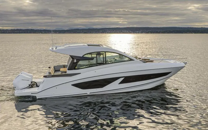 Slide: The Image of 2023 Beneteau GT32 yacht on calm water at sunset. - 6