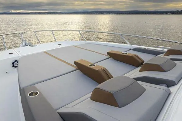 Slide: The Image of 2023 Beneteau GT32 yacht with spacious sunbathing deck on calm waters. - 7