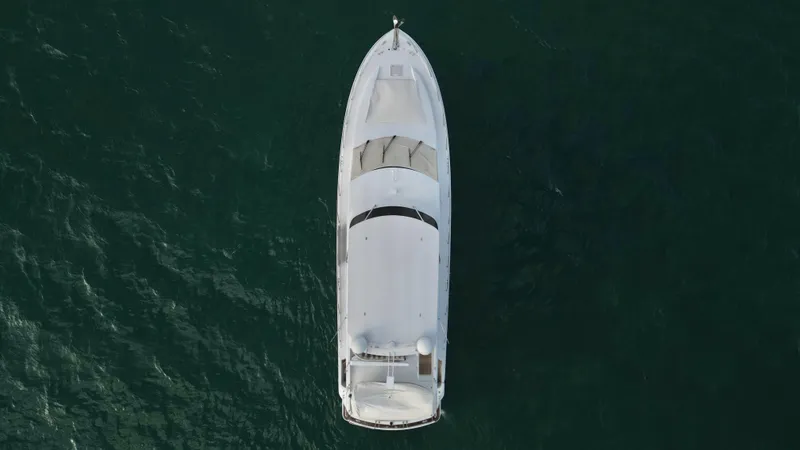 Slide: The Image of Aerial view of a 2006 Hatteras 64 Motor Yacht on open water. - 10