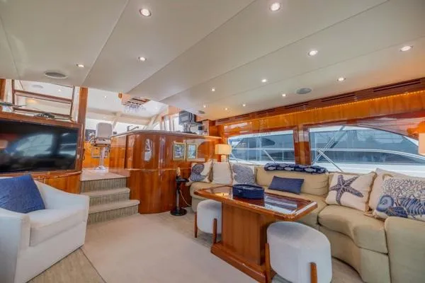 Slide: The Image of Luxurious interior of 2006 Hatteras 64 Motor Yacht with elegant seating and modern decor. - 25