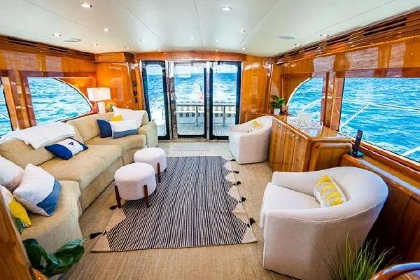 Slide: The Image of Luxurious interior of 2006 Hatteras 64 Motor Yacht with elegant seating and ocean view. - 33