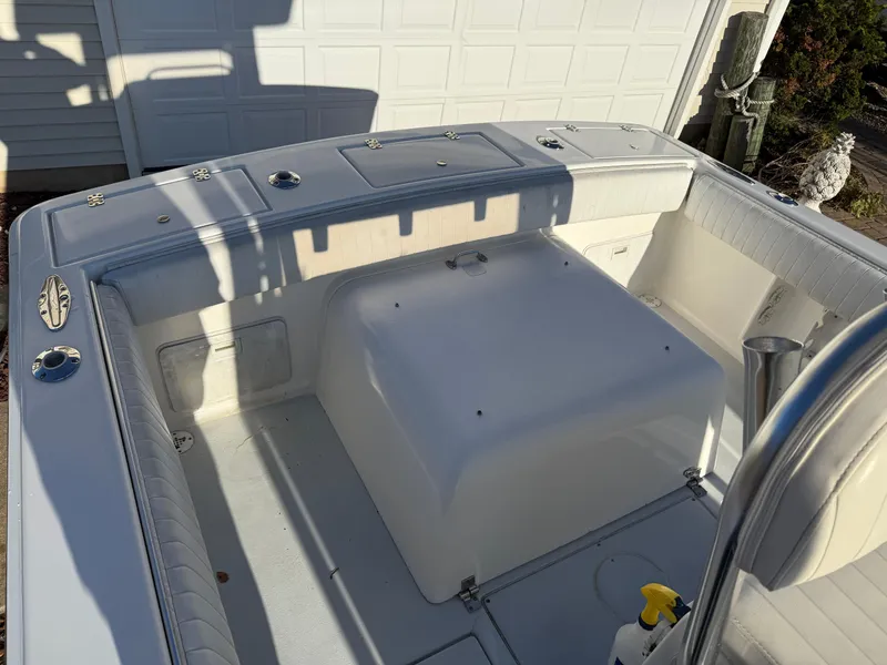 Slide: The Image of 2001 Silverhawk 24 Center Console boat interior, featuring spacious seating and storage compartments. - 15