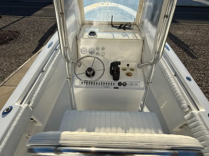 Slide: The Image of 2001 Silverhawk 24 Center Console boat interior with steering wheel and control panel. - 21