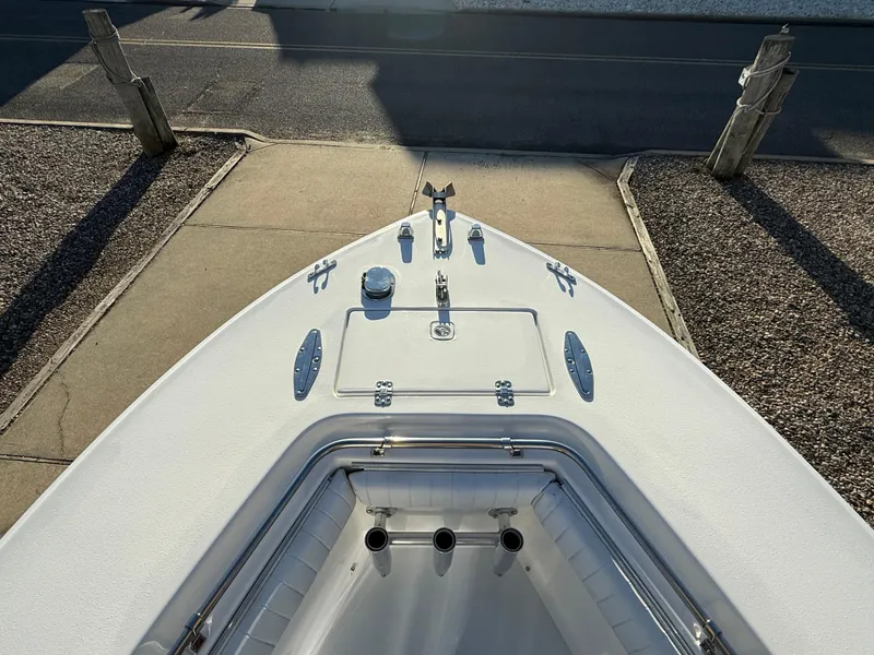 Slide: The Image of 2001 Silverhawk 24 Center Console boat bow view, docked on a sunny day. - 26