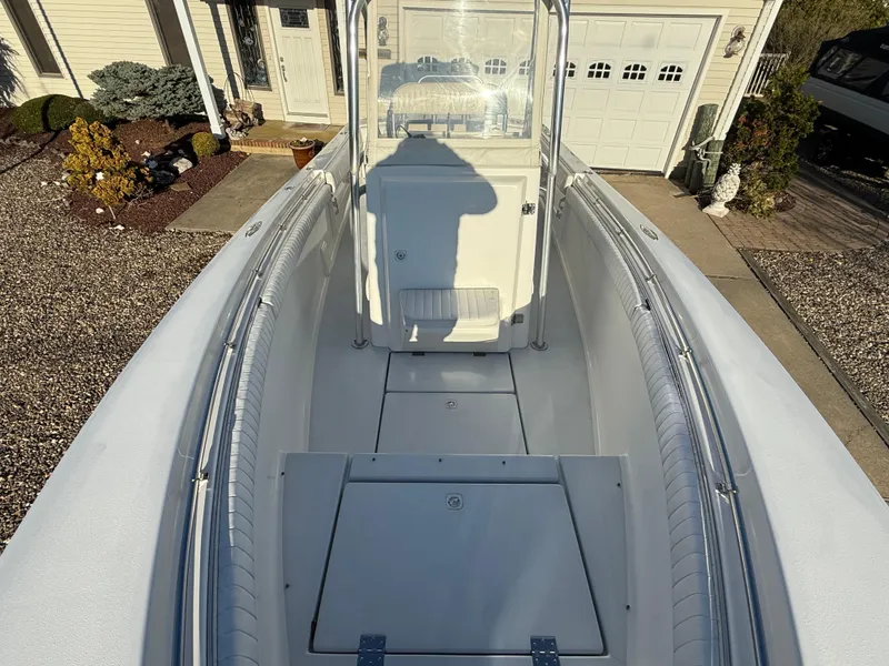 Slide: The Image of 2001 Silverhawk 24 Center Console boat, view of deck and console in driveway. - 30
