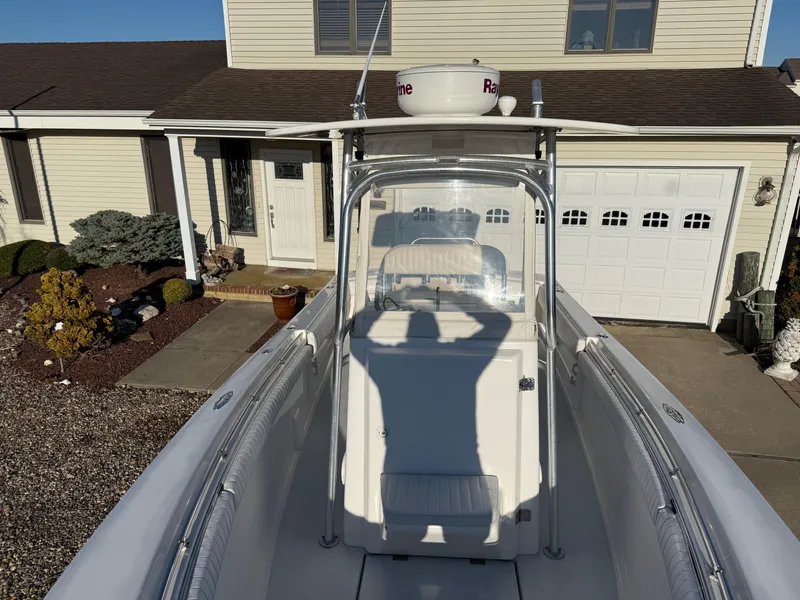 Slide: The Image of 2001 Silverhawk 24 Center Console boat parked in driveway, front view. - 35