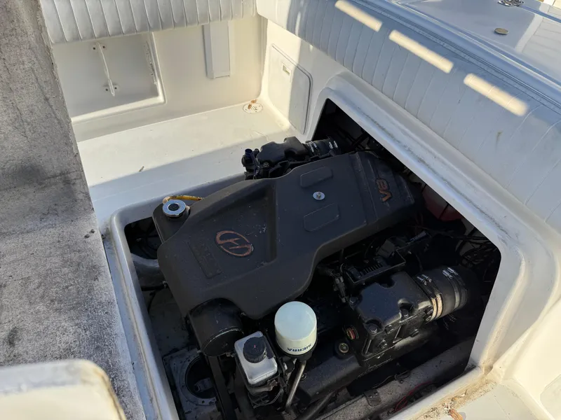 Slide: The Image of Engine compartment of a 2001 Silverhawk 24 Center Console boat, showcasing the engine details. - 36