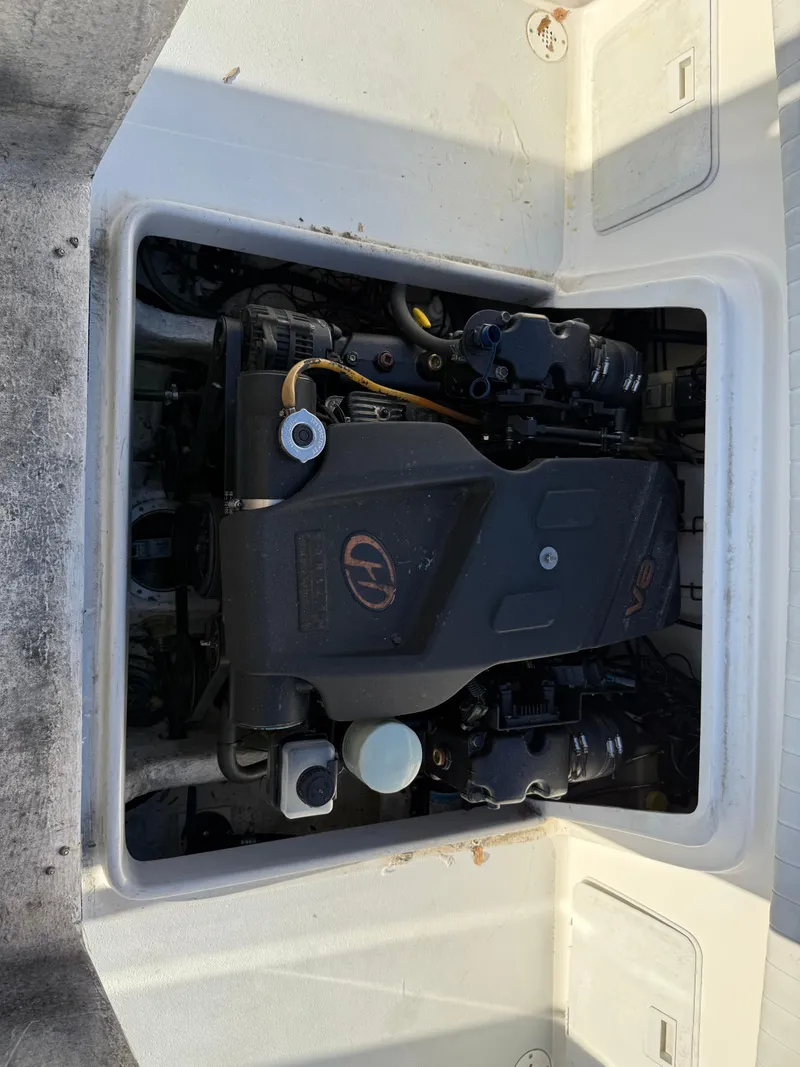 Slide: The Image of 2001 Silverhawk 24 Center Console boat engine compartment, showcasing the inboard motor. - 37
