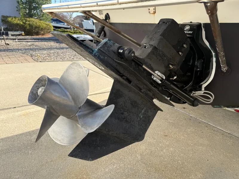 Slide: The Image of Propeller and outdrive of 2001 Silverhawk 24 Center Console boat on concrete surface. - 8
