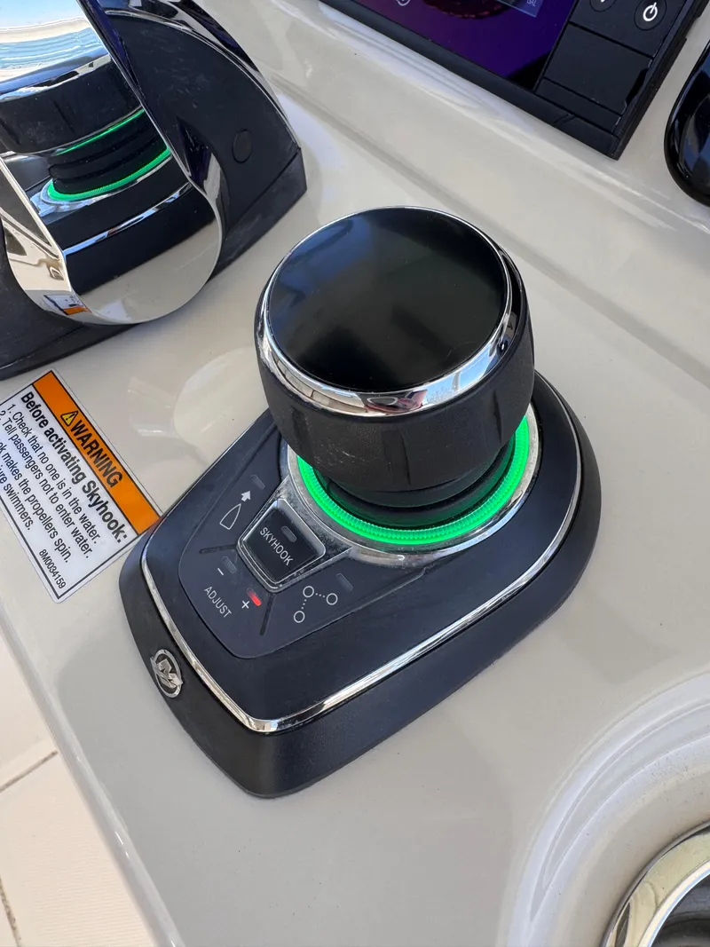Slide: The Image of Joystick control on 2018 Boston Whaler 330 Outrage boat dashboard. - 10
