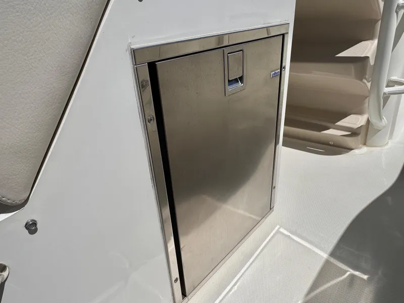 Slide: The Image of Stainless steel door on 2018 Boston Whaler 330 Outrage boat interior. - 16
