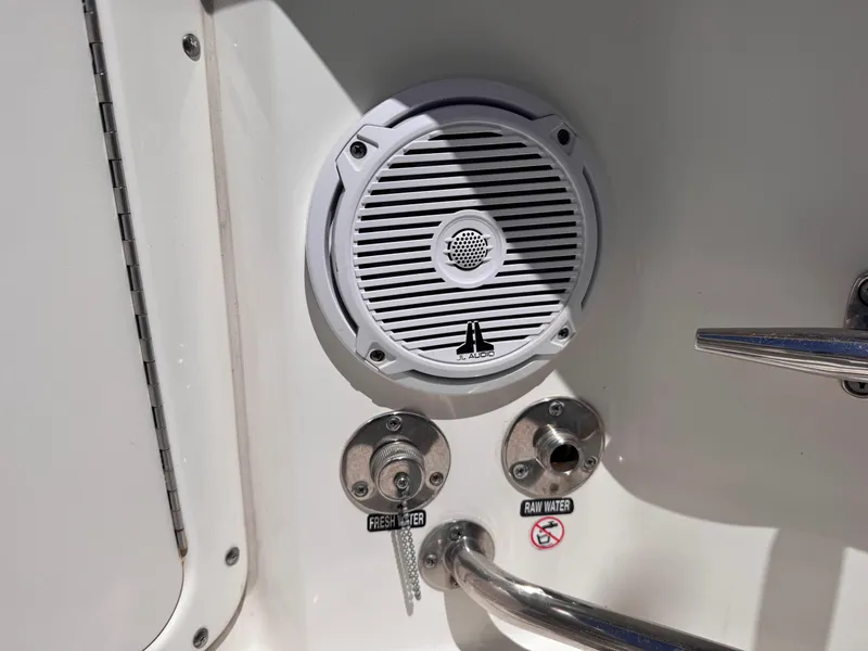 Slide: The Image of 2018 Boston Whaler 330 Outrage boat with JL Audio speaker and water access points. - 29