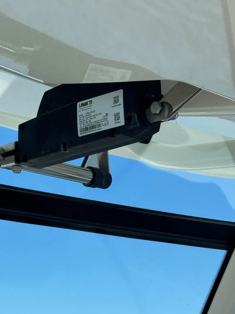Slide: The Image of Close-up of a LINAK actuator on a 2018 Boston Whaler 330 Outrage boat. - 34