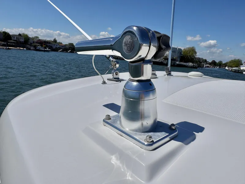Slide: The Image of 2018 Boston Whaler 330 Outrage boat detail with clear blue sky and water backdrop. - 35