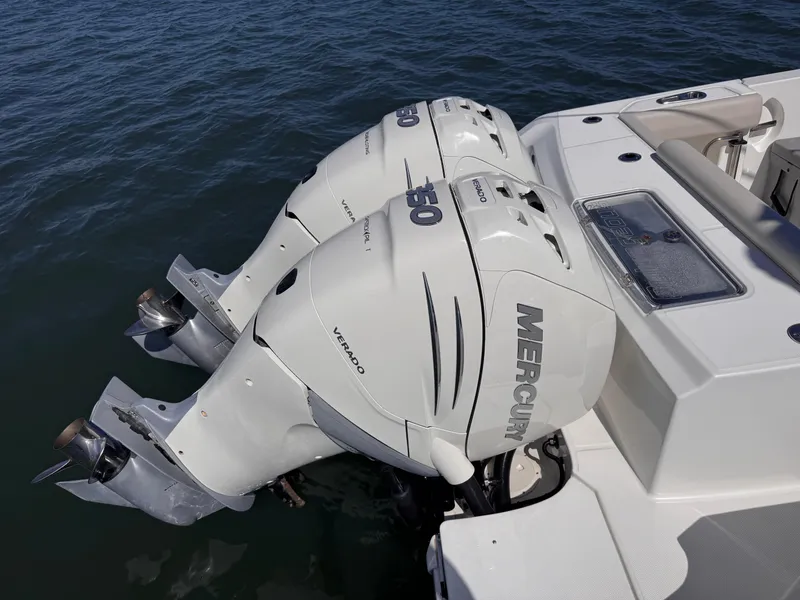 Slide: The Image of 2018 Boston Whaler 330 Outrage with twin Mercury Verado engines on water. - 43