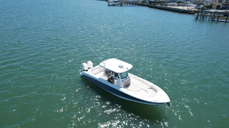 Slide: The Image of 2018 Boston Whaler 330 Outrage boat on calm water, aerial view. - 44