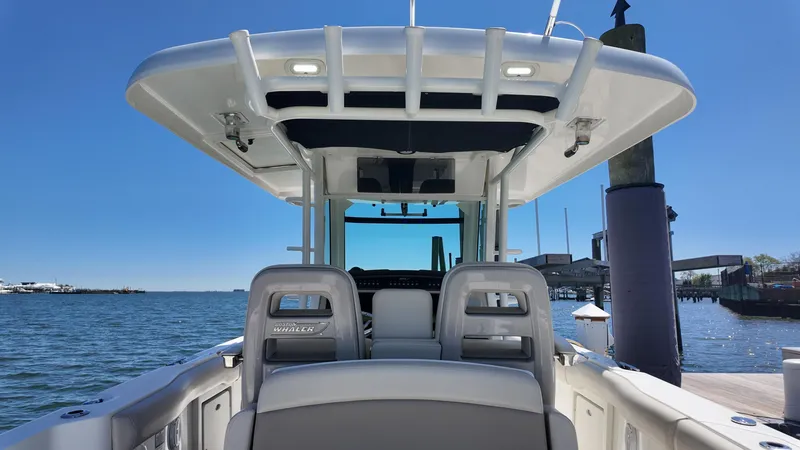 Slide: The Image of 2018 Boston Whaler 330 Outrage boat interior with ocean view and clear sky. - 6