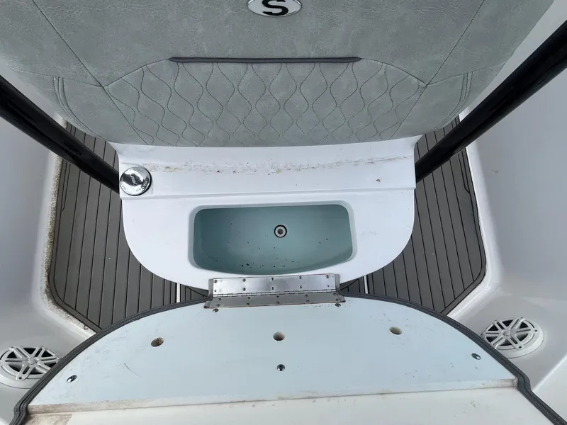 Slide: The Image of 2020 Sportsman Open 232 Center Console boat interior with storage compartment. - 10