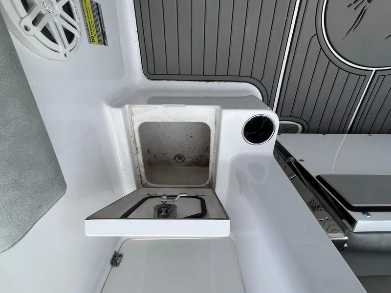 Slide: The Image of 2020 Sportsman Open 232 Center Console boat interior with sink and speaker. - 16