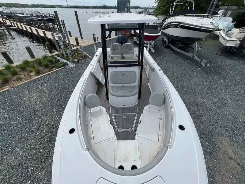 Slide: The Image of 2020 Sportsman Open 232 Center Console boat docked near waterfront. - 21