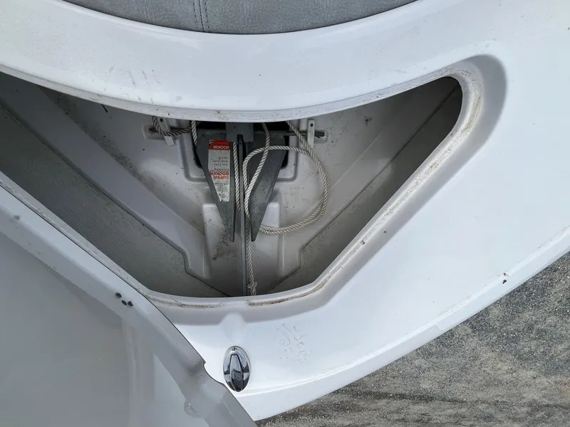 Slide: The Image of Anchor storage compartment on a 2020 Sportsman Open 232 Center Console boat. - 23