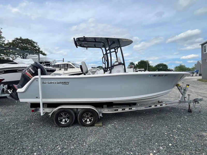 Slide: The Image of 2020 Sportsman Open 232 Center Console boat on trailer, parked outdoors. - 4