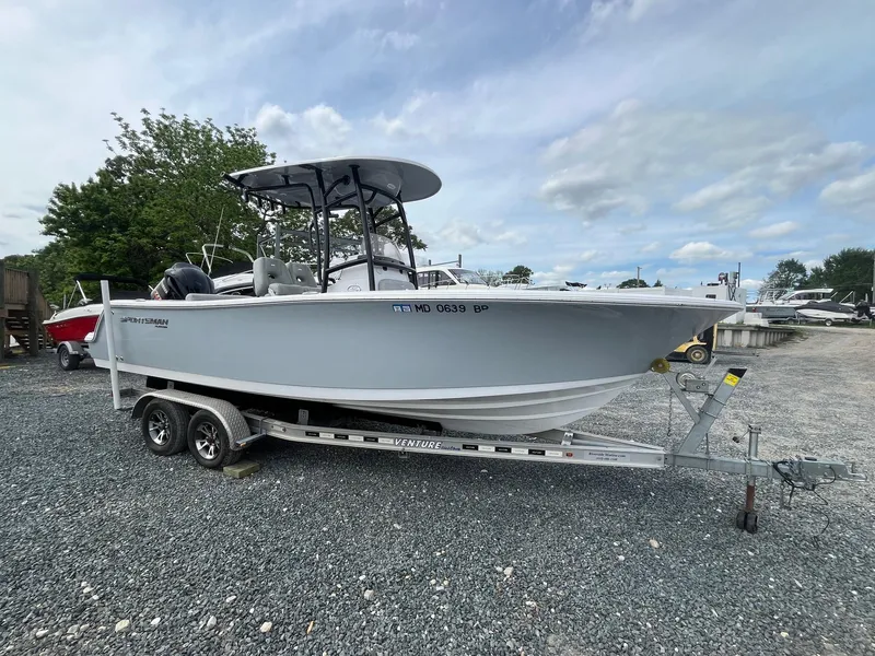 Slide: The Image of 2020 Sportsman Open 232 Center Console boat on trailer, parked outdoors. - 5