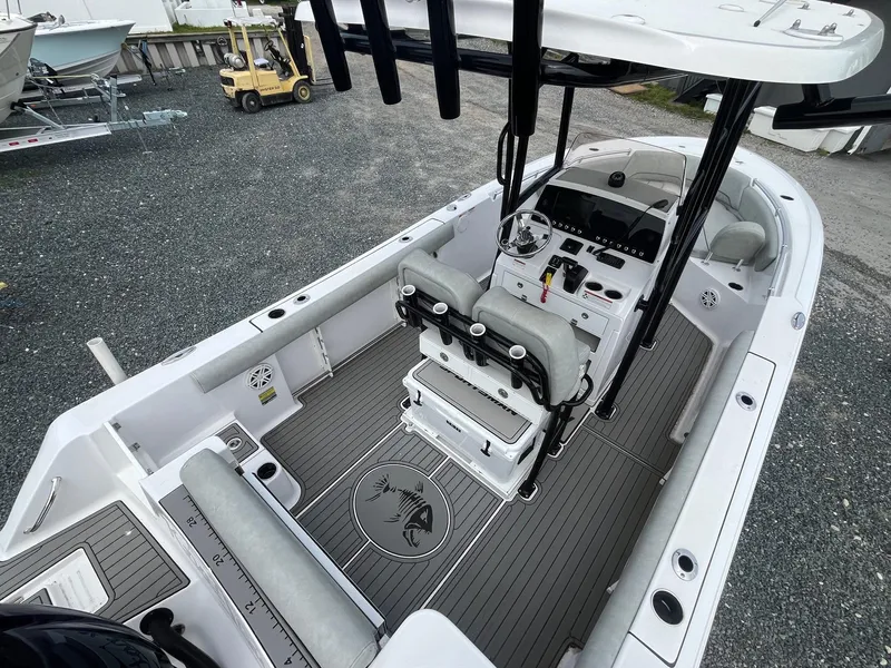 Slide: The Image of 2020 Sportsman Open 232 Center Console boat interior with seating and controls. - 6