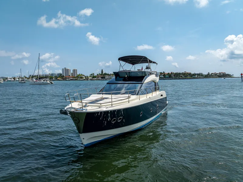 Slide: The Image of 2015 Beneteau Monte Carlo 5 yacht cruising on a sunny day in open waters. - 13