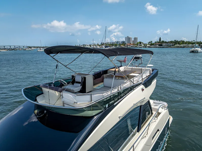 Slide: The Image of 2015 Beneteau Monte Carlo 5 yacht with spacious deck, cruising on a sunny day. - 14