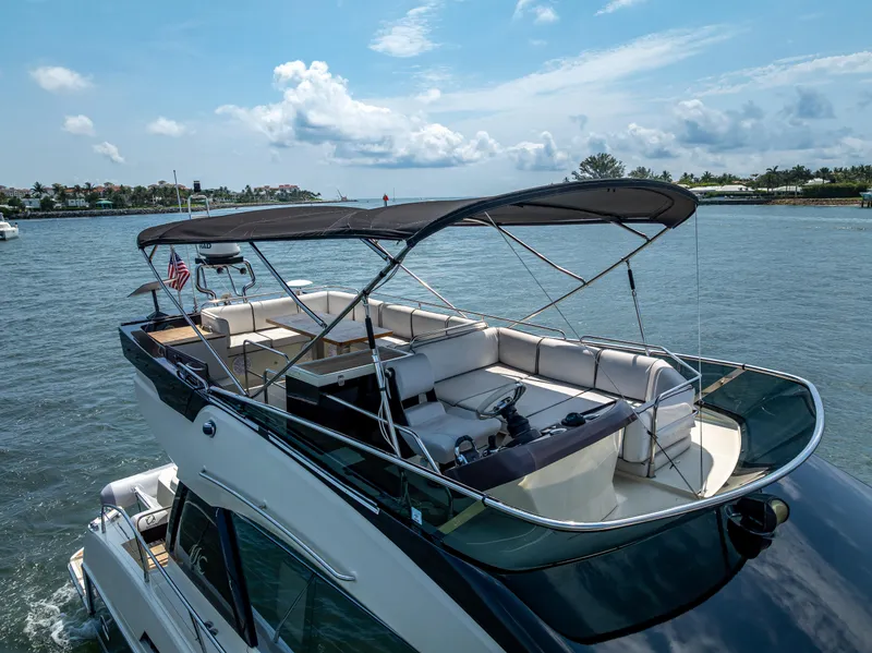Slide: The Image of 2015 Beneteau Monte Carlo 5 yacht with spacious deck, cruising on a sunny day. - 16