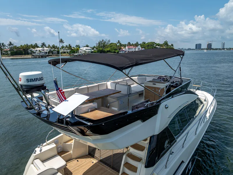 Slide: The Image of 2015 Beneteau Monte Carlo 5 yacht with flybridge, cruising on a sunny day. - 18