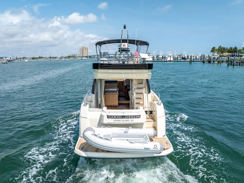 Slide: The Image of 2015 Beneteau Monte Carlo 5 yacht cruising in a marina, rear view. - 20