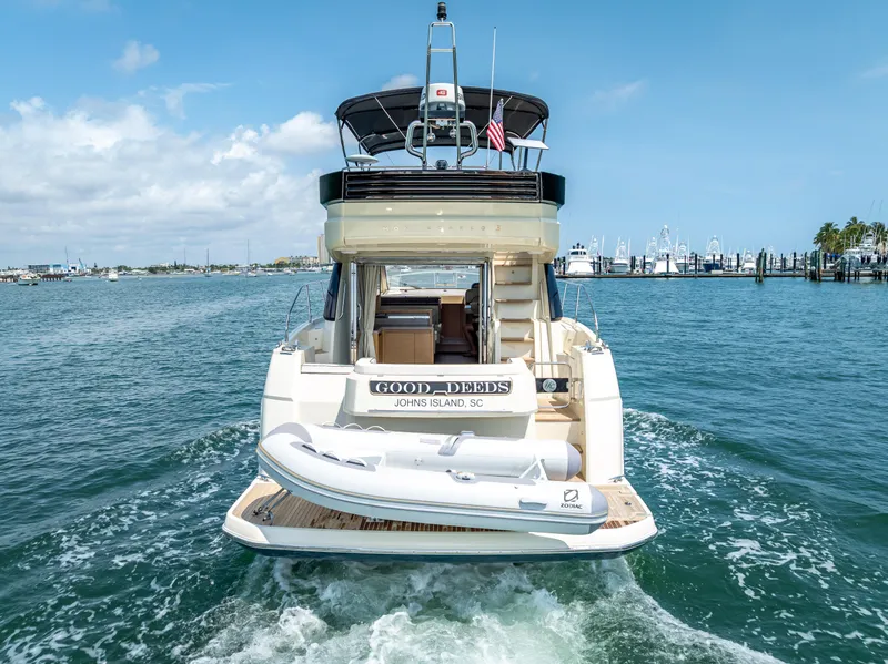 Slide: The Image of 2015 Beneteau Monte Carlo 5 yacht cruising on open water, rear view. - 21