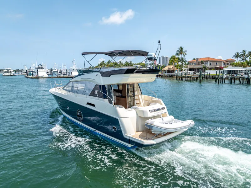 Slide: The Image of 2015 Beneteau Monte Carlo 5 yacht cruising in a sunny marina. - 22