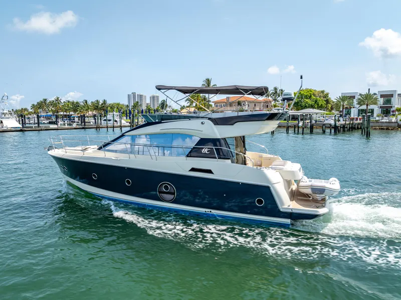 Slide: The Image of 2015 Beneteau Monte Carlo 5 yacht cruising in a sunny marina. - 24