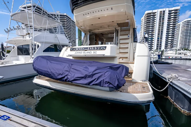 Slide: The Image of 2015 Beneteau Monte Carlo 5 yacht docked at marina with covered equipment. - 30