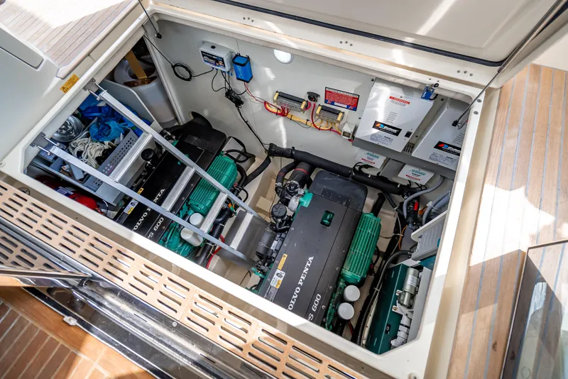 Slide: The Image of Engine room of 2015 Beneteau Monte Carlo 5 yacht, showcasing dual engines and electrical systems. - 31