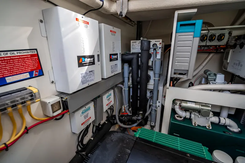 Slide: The Image of Engine room of 2015 Beneteau Monte Carlo 5, showcasing electrical systems and components. - 33
