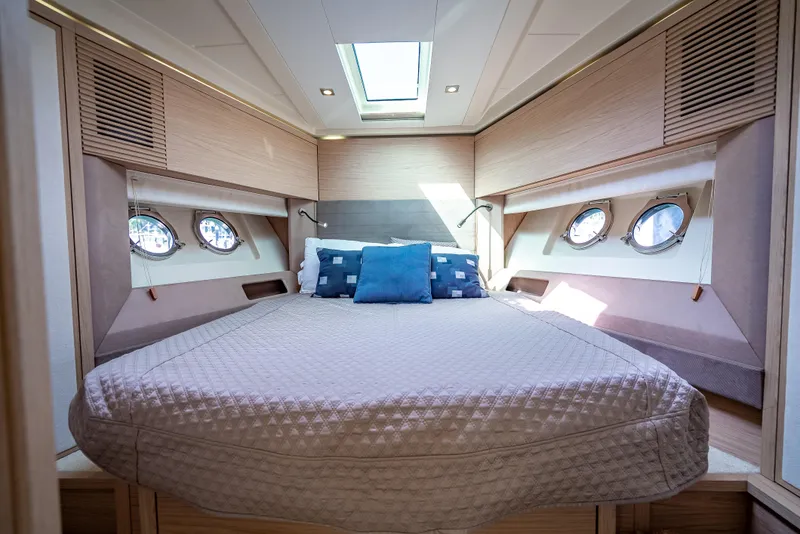 Slide: The Image of Luxurious cabin interior of 2015 Beneteau Monte Carlo 5 yacht with skylight and portholes. - 40