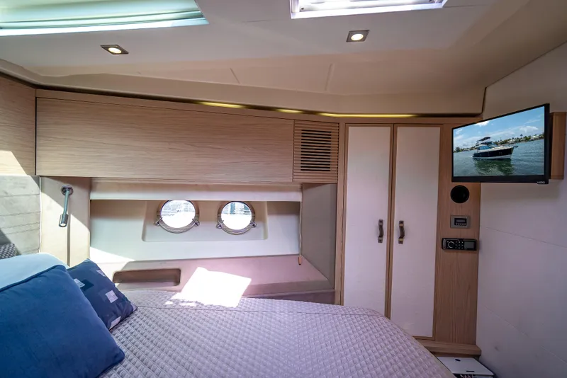 Slide: The Image of Luxurious cabin interior of 2015 Beneteau Monte Carlo 5 yacht with TV and portholes. - 41