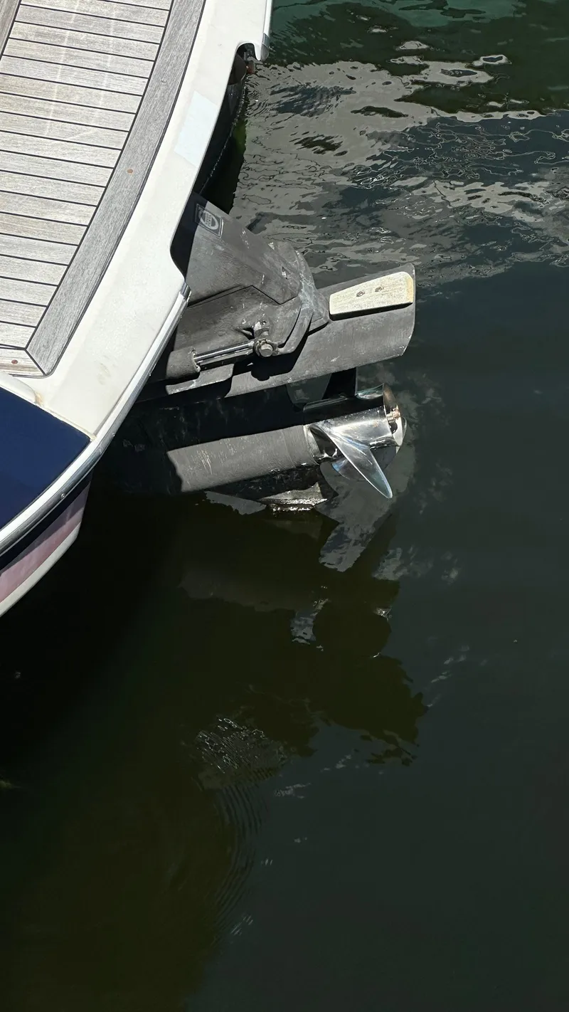 Slide: The Image of 2009 Chris-Craft Corsair 25 boat stern and propeller in water. - 27