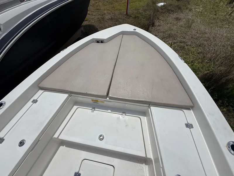 Slide: The Image of 2015 NauticStar 244 XTS boat deck with storage compartments. - 17