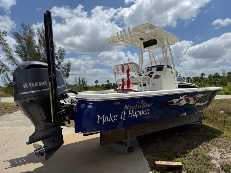 Slide: The Image of 2015 NauticStar 244 XTS boat with Yamaha engine on a sunny day. - 3