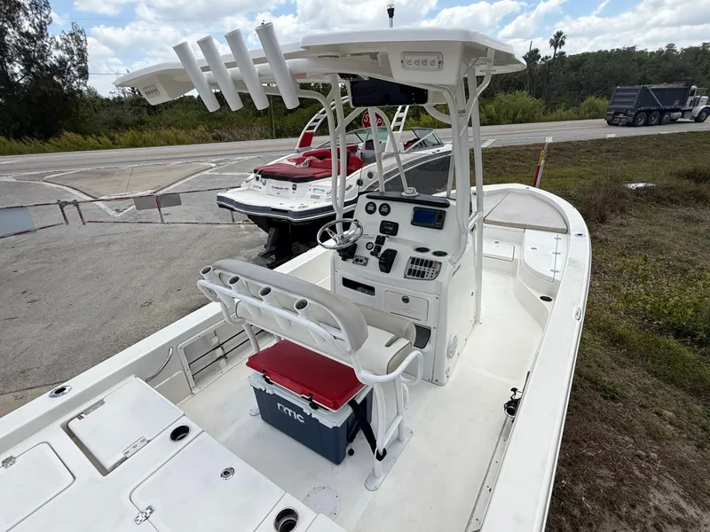 Slide: The Image of 2015 NauticStar 244 XTS boat with center console and fishing rod holders. - 7